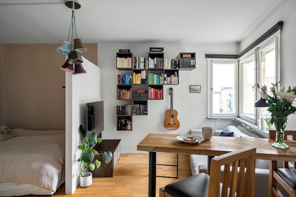 Apartment Interior with guitar and booskhelf